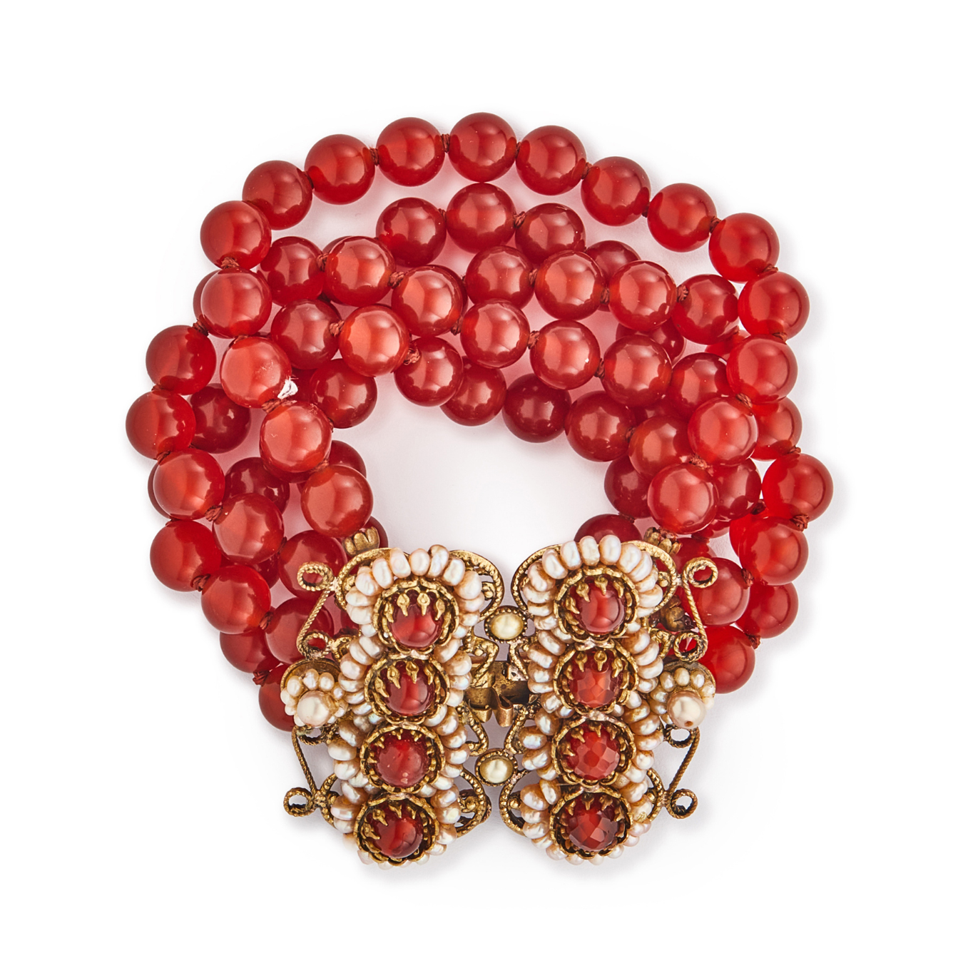 Spectacular antique carnelian five-strand bracelet with a very ornate brass, carnelian and seed pearl clasp. A real statement piece!
