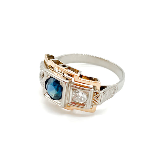 Stylish Art Deco 14ct white and rose gold ring set with a centre 0.50ct sapphire, and a 0.15ct diamond on each side. Lovey engraving on the shoulders. Italy