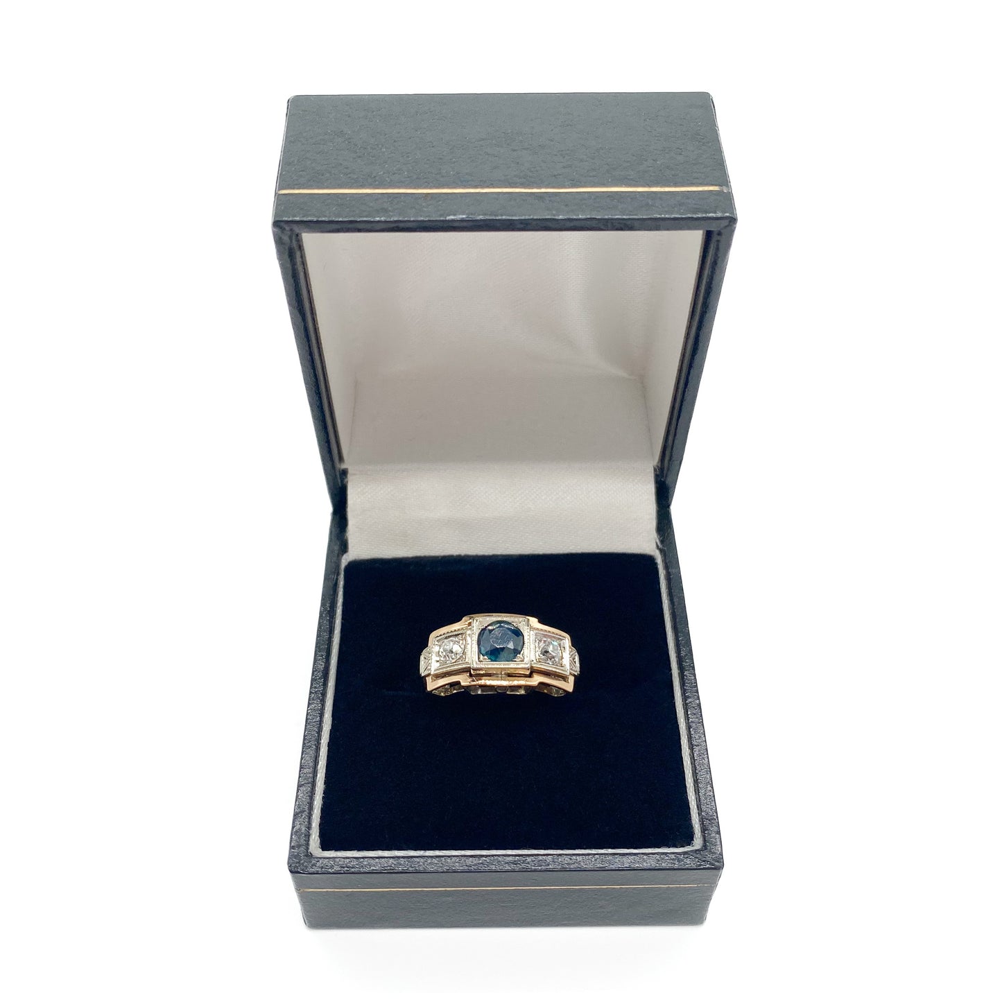 Stylish Art Deco 14ct white and rose gold ring set with a centre 0.50ct sapphire, and a 0.15ct diamond on each side. Lovey engraving on the shoulders. Italy