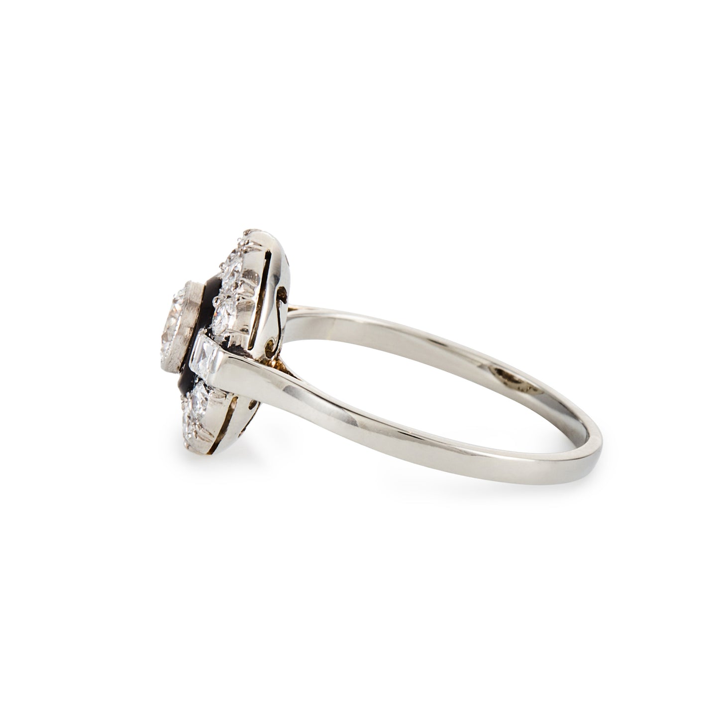 Classic Art Deco 14ct white gold ring, with a 0.50ct tube set old cut diamond, surrounded by a black enamel collar and ten smaller diamonds, flanked by two baguette diamonds.