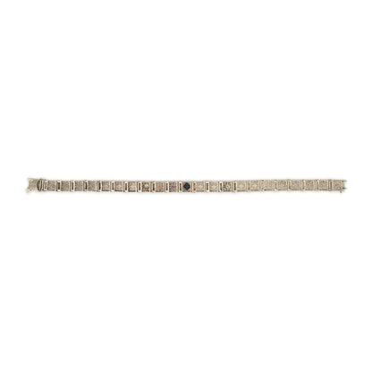 Elegant Art Deco 14ct white gold filigree bracelet set with two round, natural diamonds and a deep-blue sapphire.
