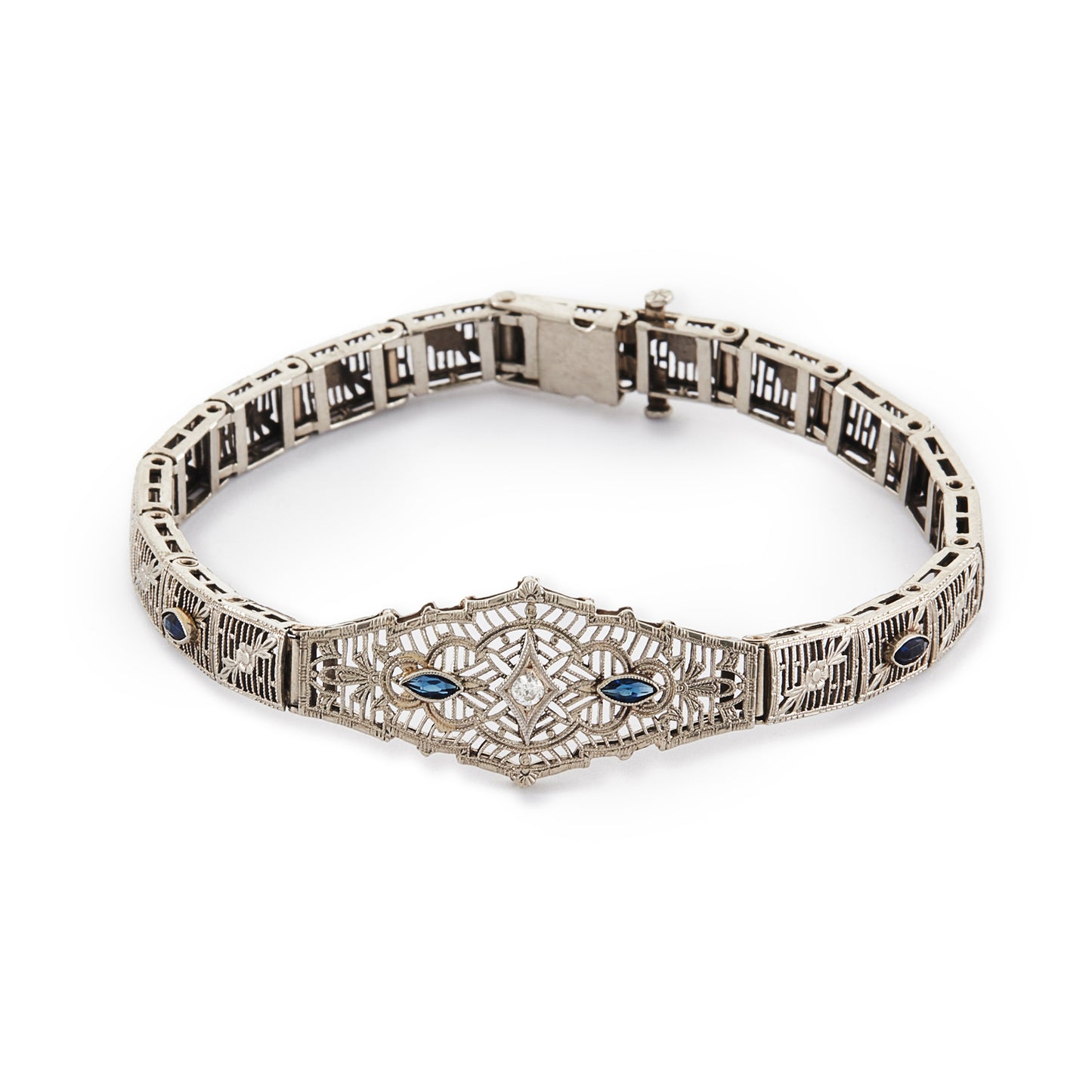 Intricate Art Deco filigree 14ct white gold bracelet set with four marquise sapphires and a round 0,10ct diamond in the centre.