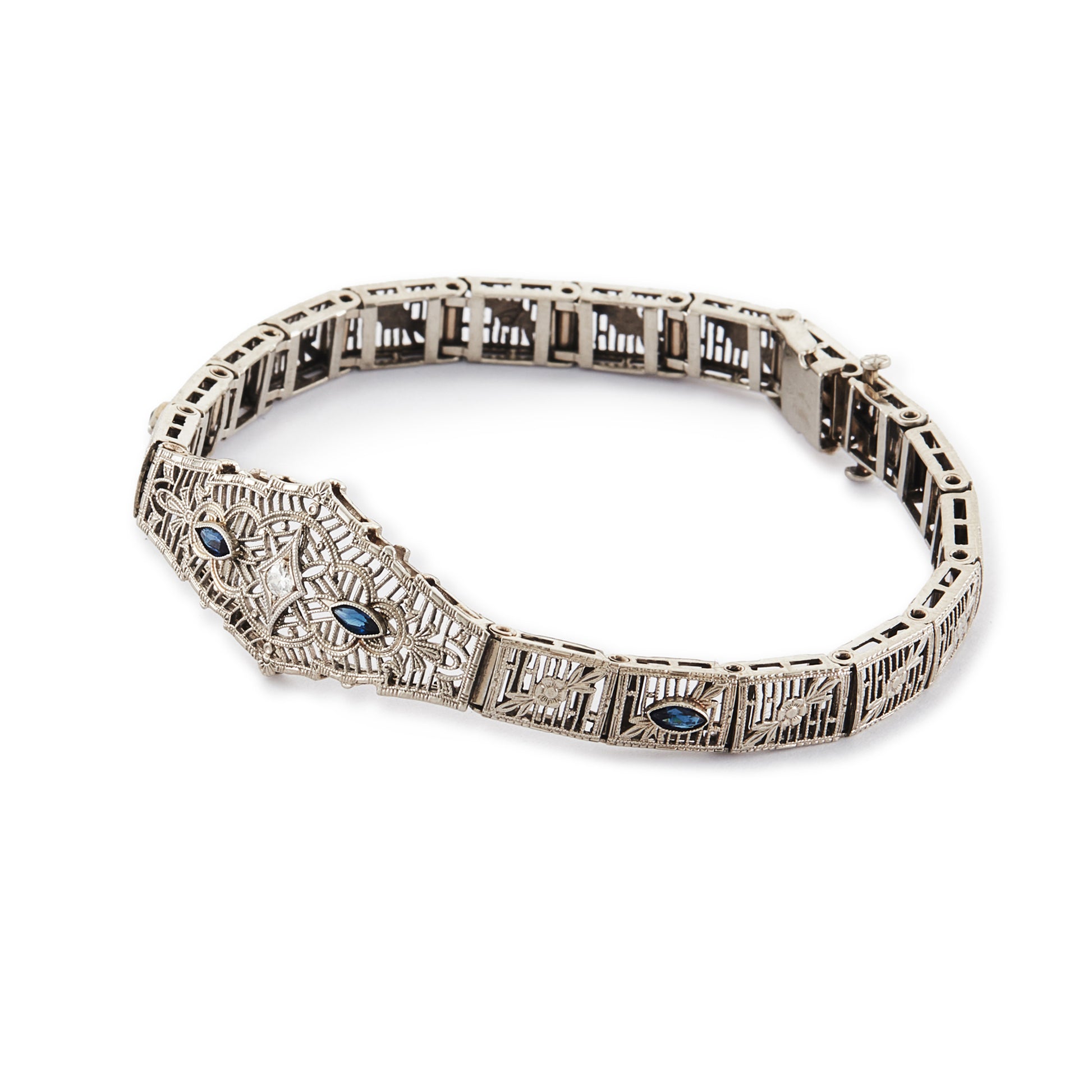 Intricate Art Deco filigree 14ct white gold bracelet set with four marquise sapphires and a round 0,10ct diamond in the centre.