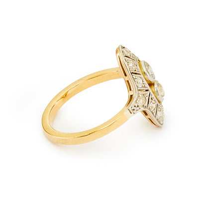 Stunning Art Deco ring with two centre, natural, old-cut diamonds, surrounded by twelve smaller old cut diamonds in an intricate 18ct white gold milgrain setting, with an 18ct yellow gold shank.