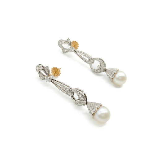 Stunning Art Deco 18ct white gold articulated drop earrings, each set with a 0.10ct diamond, thirty-three pavé set diamonds and a lustrous pearl. 18ct Rose gold pin and butterfly. Argentina