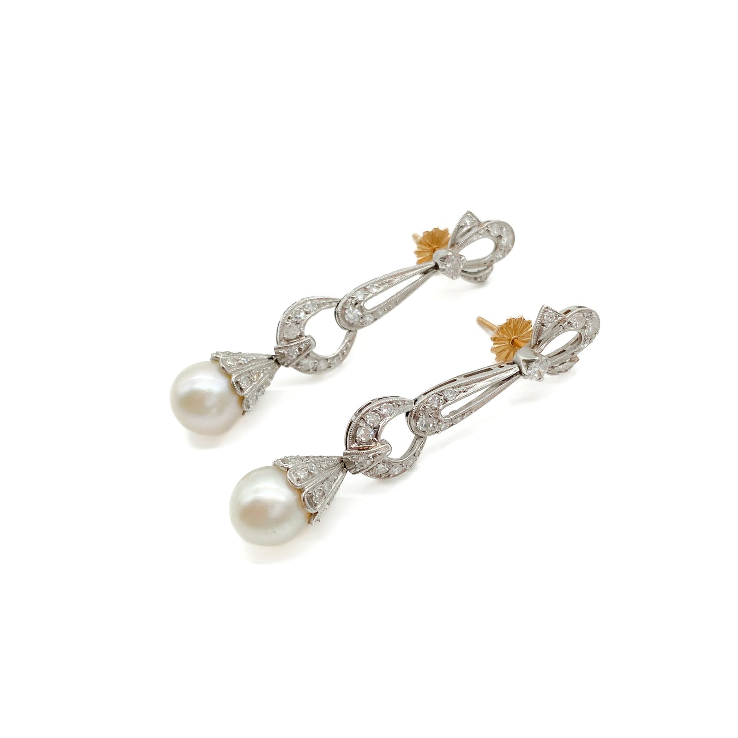 Stunning Art Deco 18ct white gold articulated drop earrings, each set with a 0.10ct diamond, thirty-three pavé set diamonds and a lustrous pearl. 18ct Rose gold pin and butterfly. Argentina