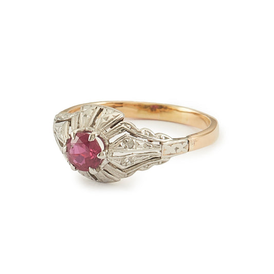 Dainty Art Deco 18ct gold and platinum ring set with an old-cut faceted ruby.