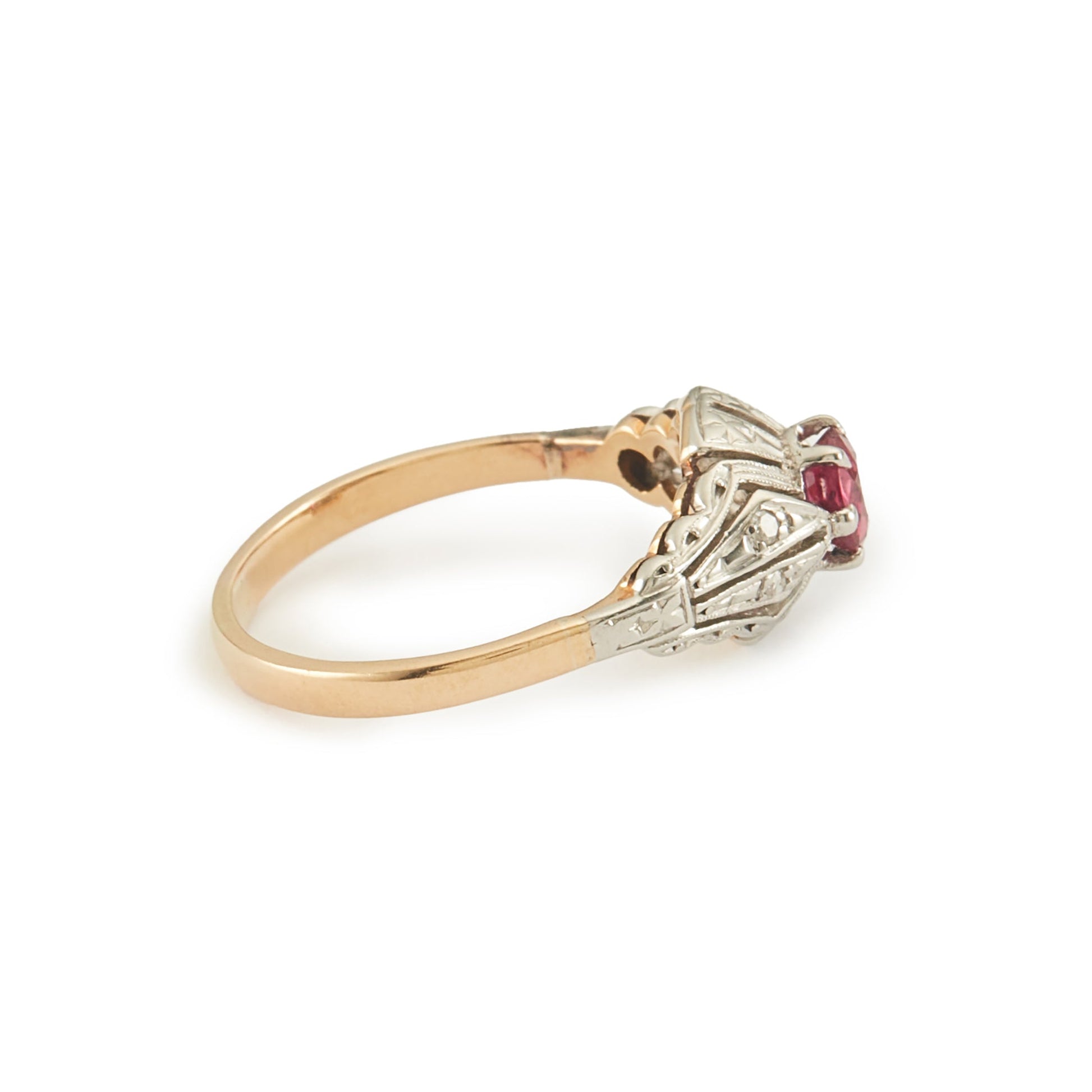 Dainty Art Deco 18ct gold and platinum ring set with an old-cut faceted ruby.