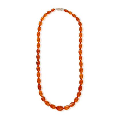 Beautifully faceted Art Deco Baltic amber necklace with an engraved silver clasp. The graduated amber beads have very sought after varied natural cognac hues.