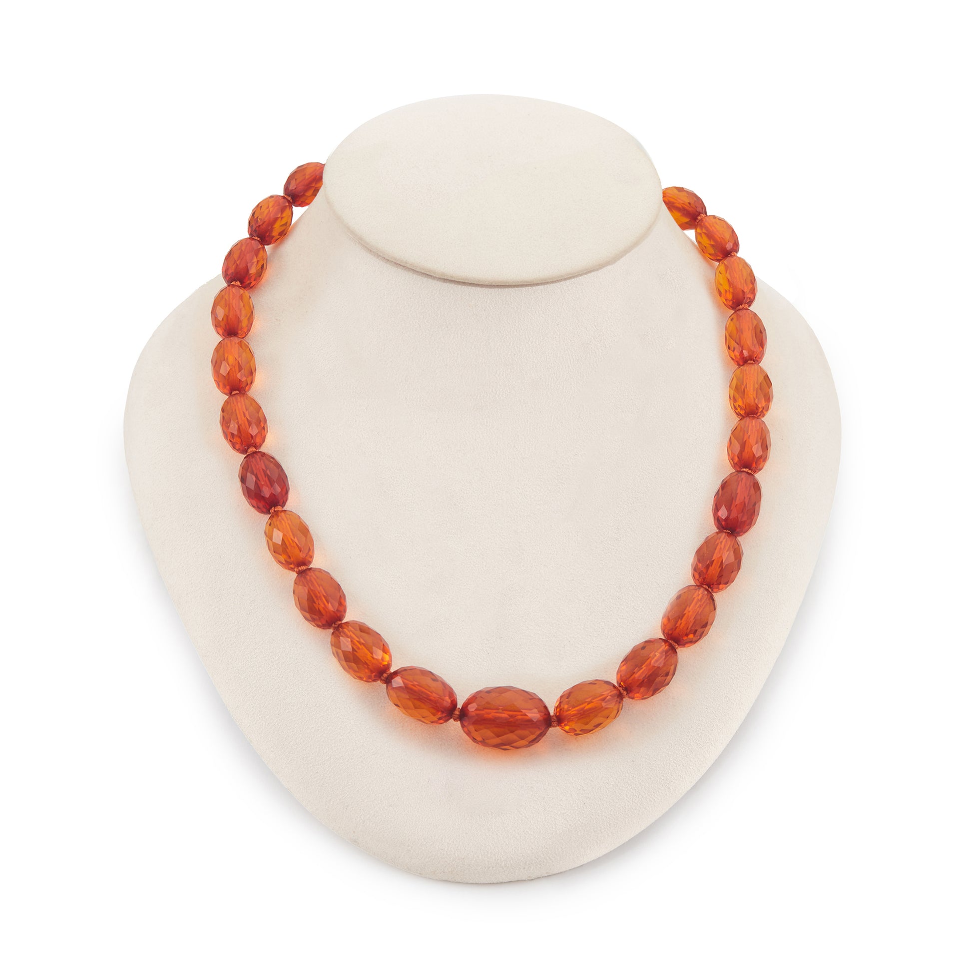 Beautifully faceted Art Deco Baltic amber necklace with an engraved silver clasp. The graduated amber beads have very sought after varied natural cognac hues.