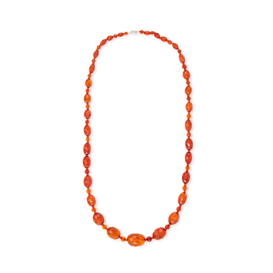 Beautifully faceted Art Deco Baltic amber necklace with an engraved silver clasp. The graduated amber beads have very sought after, varied natural cognac hues.