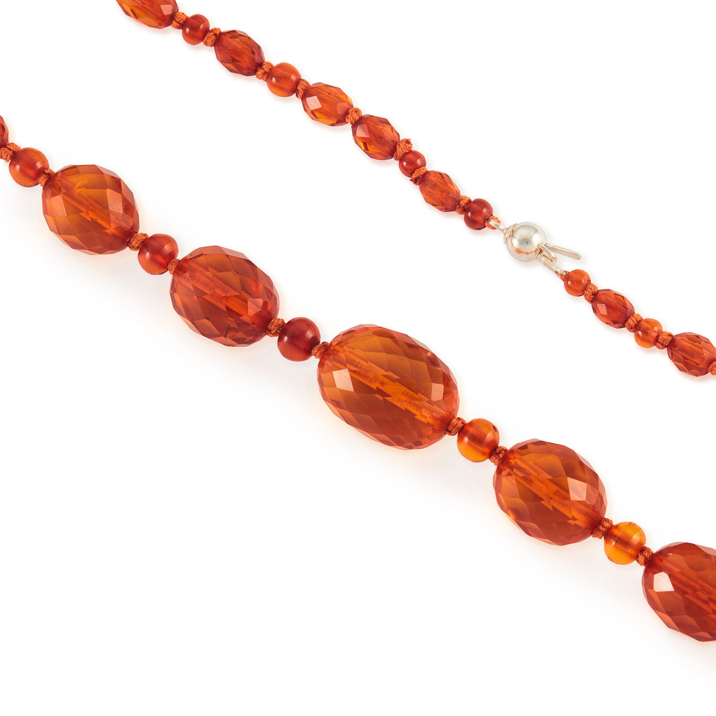 Beautifully faceted Art Deco Baltic amber necklace with an engraved silver clasp. The graduated amber beads have very sought after, varied natural cognac hues.