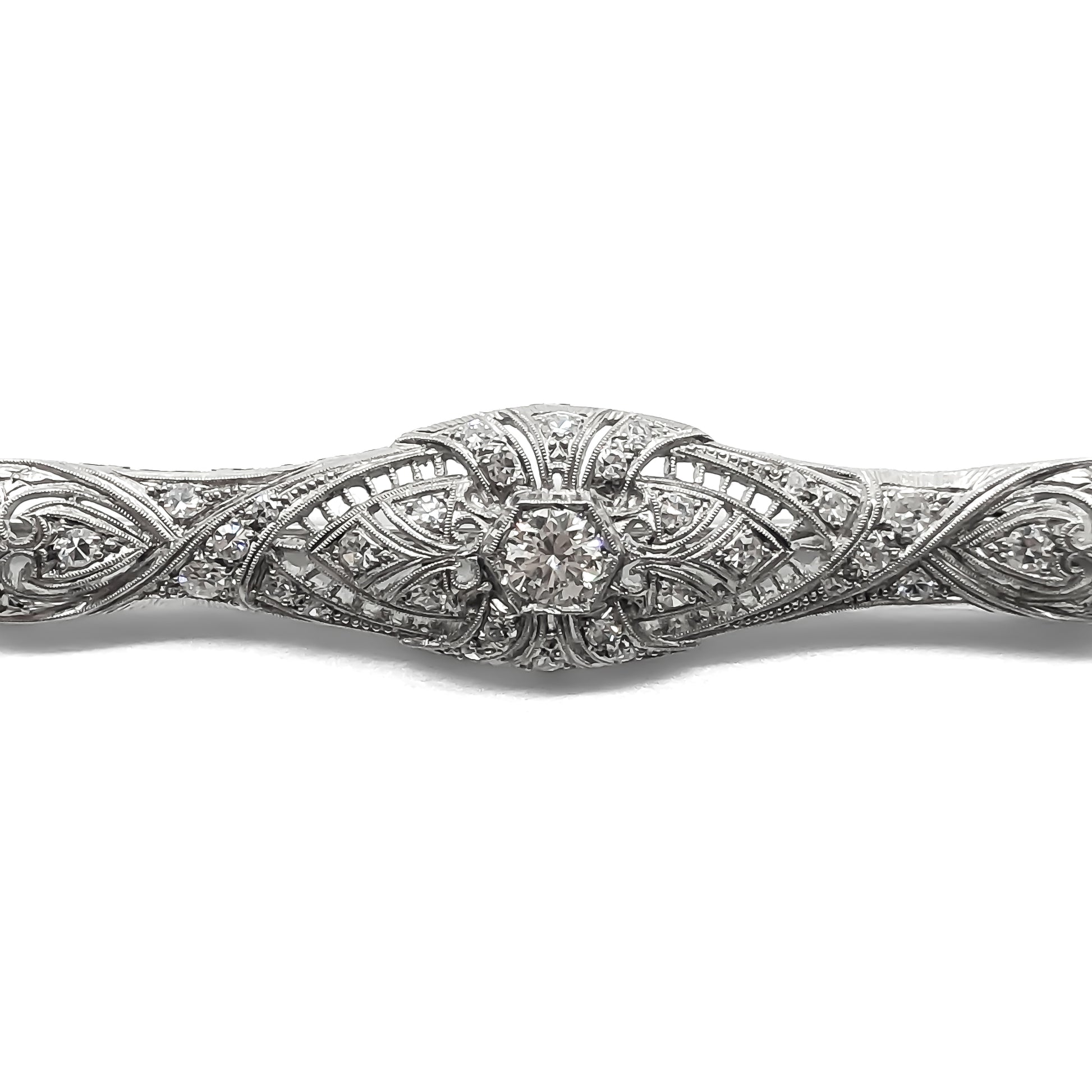Stunning Art Deco platinum diamond brooch with a 0.40ct centre diamond and thirty smaller diamonds in an intricate filigree setting. Circa 1920s