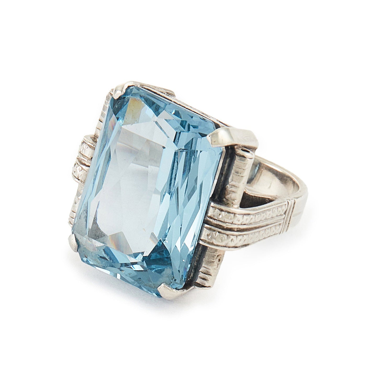 Stunning Art Deco sterling silver ring set with a large, beautifully faceted, sky blue, lab-grown spinel.
Makers mark.