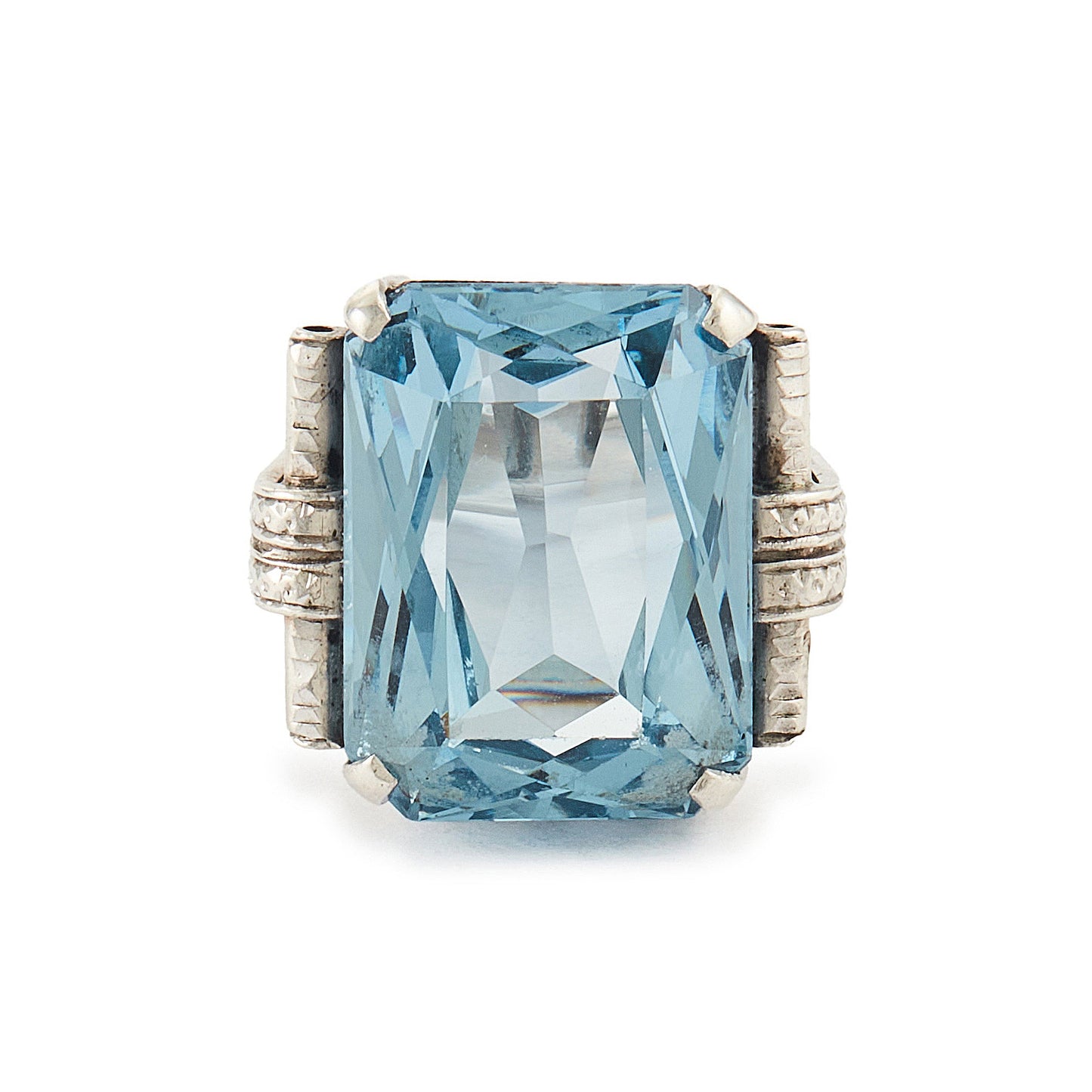 Stunning Art Deco sterling silver ring set with a large, beautifully faceted, sky blue, lab-grown spinel.
Makers mark.