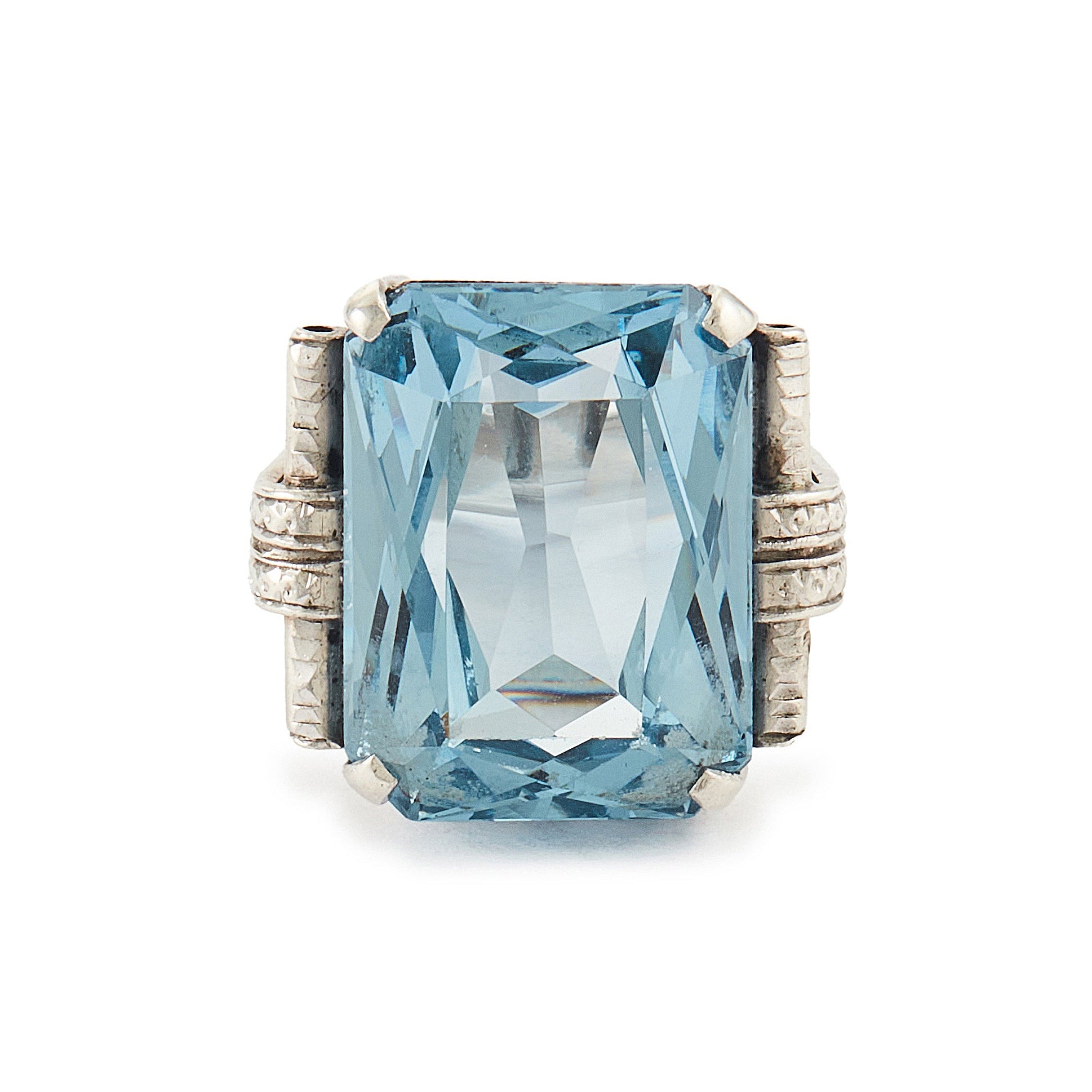 Stunning Art Deco sterling silver ring set with a large, beautifully faceted, sky blue, lab-grown spinel.
Makers mark.