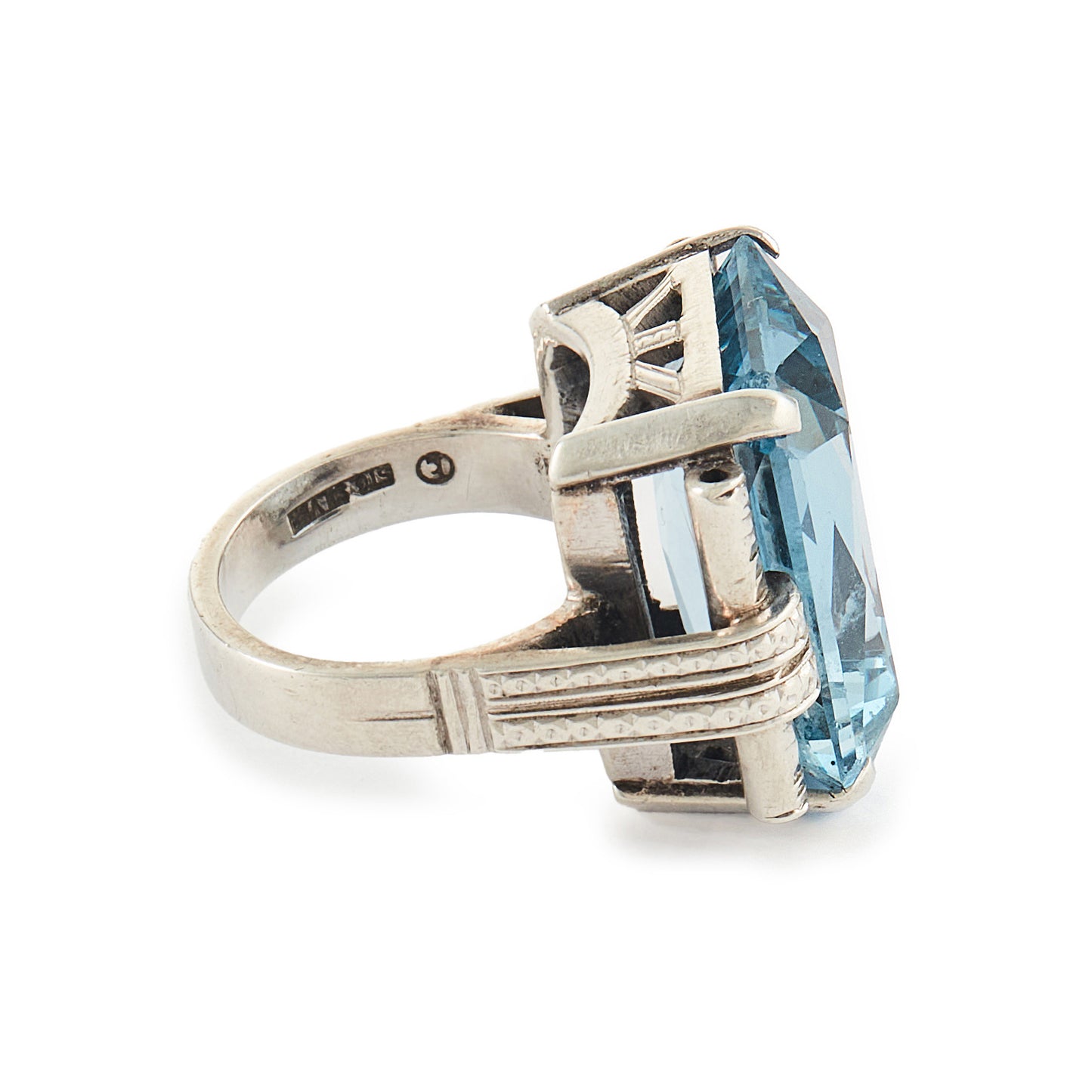 Stunning Art Deco sterling silver ring set with a large, beautifully faceted, sky blue, lab-grown spinel.
Makers mark.