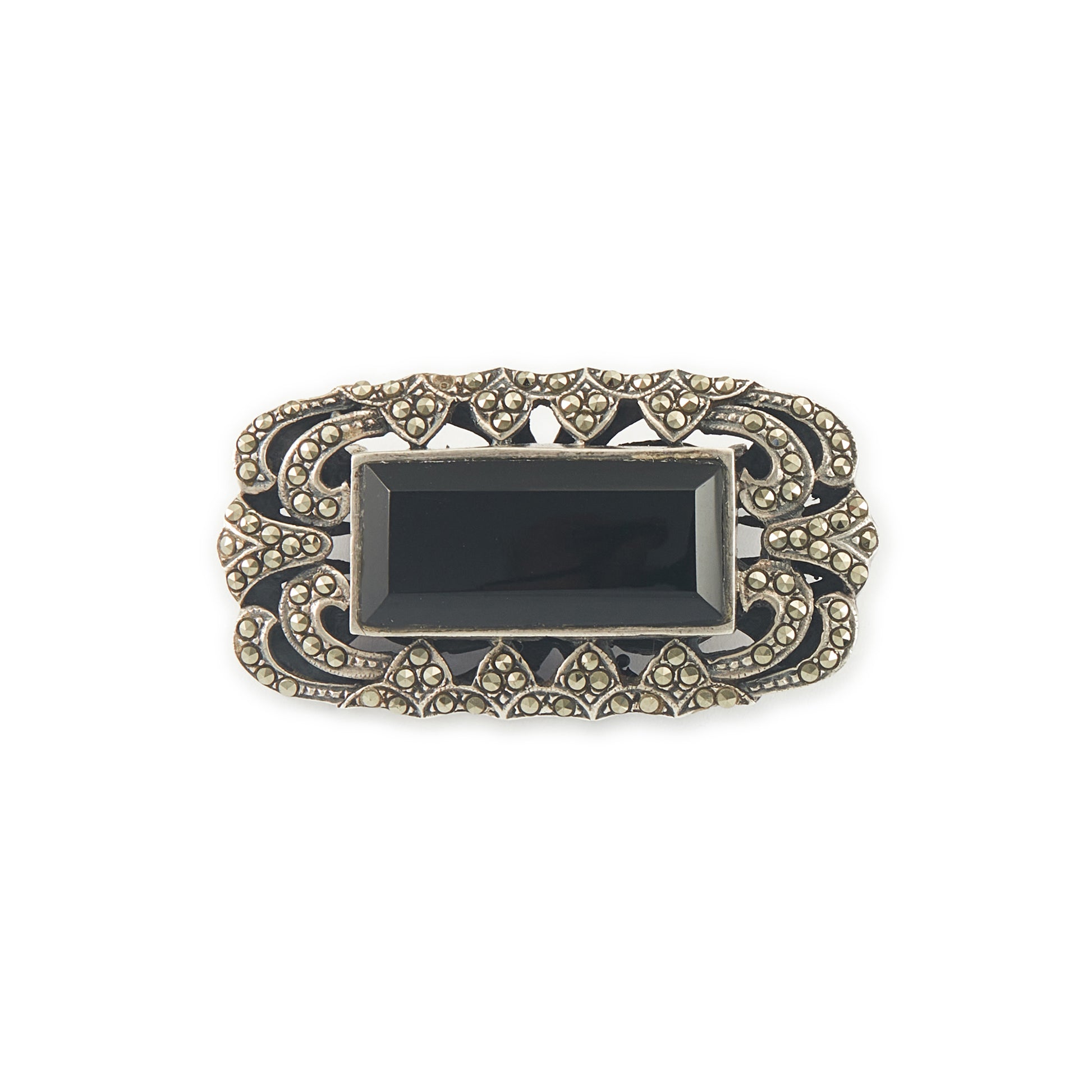 Stylish Art Deco sterling silver marcasite brooch set with a rectangular black onyx stone. Safety clasp.