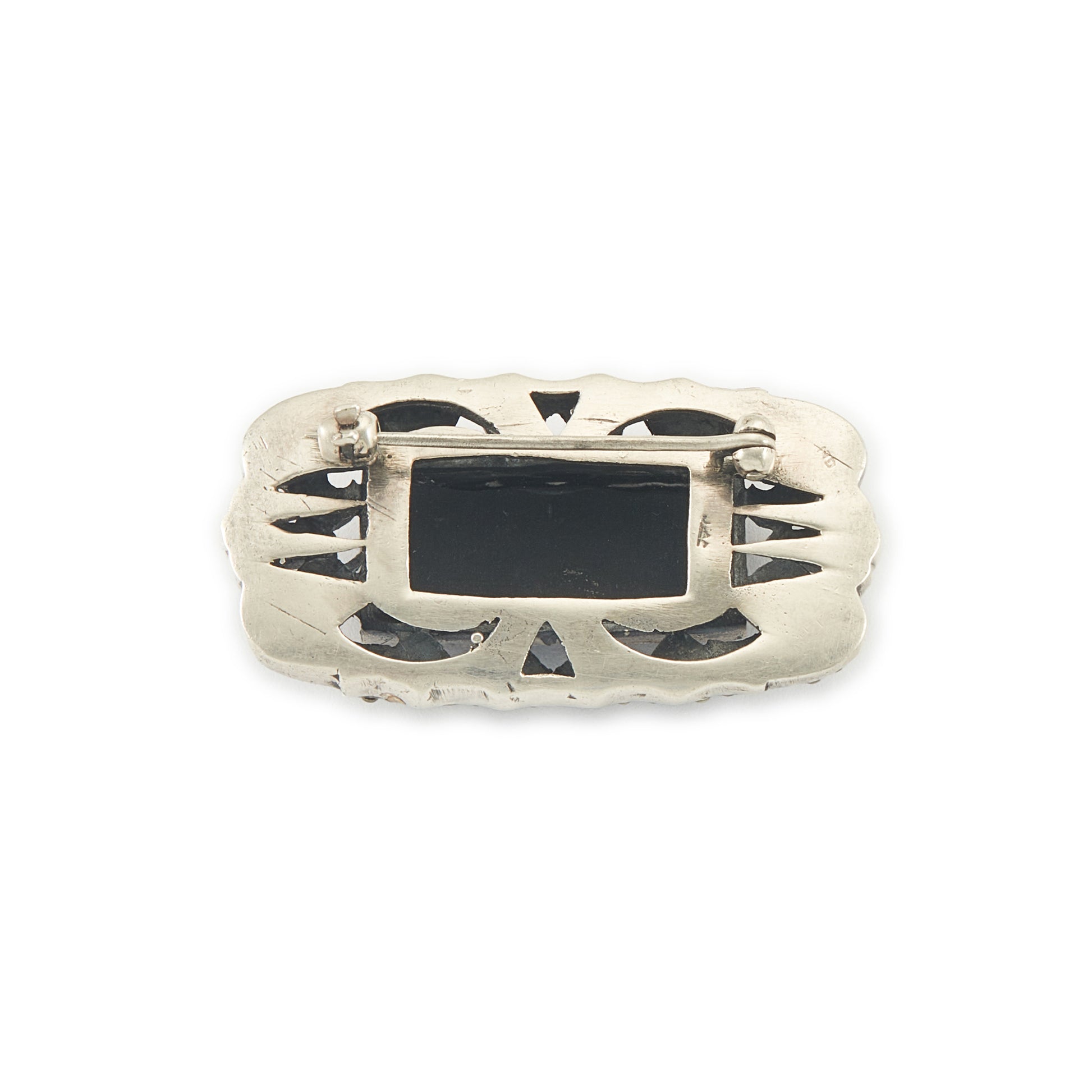 Stylish Art Deco sterling silver marcasite brooch set with a rectangular black onyx stone. Safety clasp.