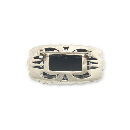 Stylish Art Deco sterling silver marcasite brooch set with a rectangular black onyx stone. Safety clasp.