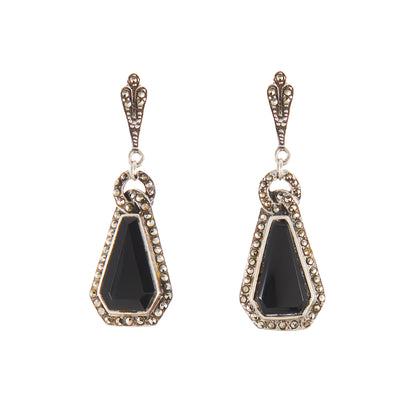 Sterling silver Art Deco marcasite earrings, each set with a faceted onyx stone, surrounded by marcasites.