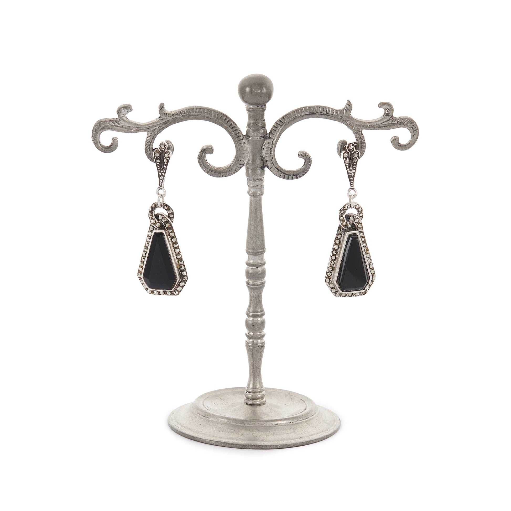 Sterling silver Art Deco marcasite earrings, each set with a faceted onyx stone, surrounded by marcasites.