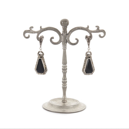 Sterling silver Art Deco marcasite earrings, each set with a faceted onyx stone, surrounded by marcasites.