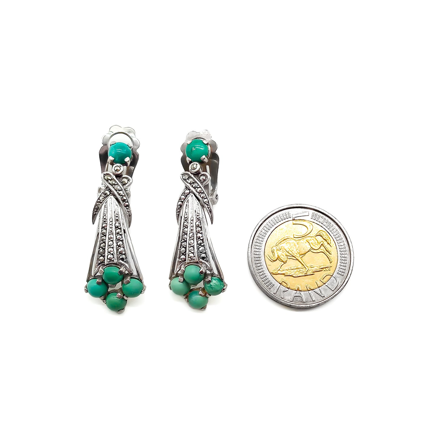Glamorous Art Deco clip-on drop earrings set with cabochon turquoise stones and marcasites.  Circa 1930’s