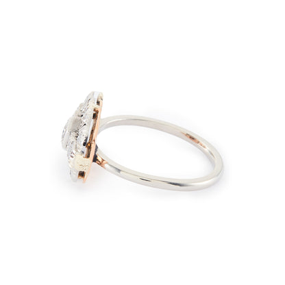 Beautiful Art Deco platinum and 18ct rose gold ring set with thirteen old-cut diamonds in an ornate setting.