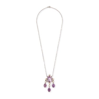 Beautiful Arts and Crafts silver necklace set with four chunky purple faceted amethysts, seven lustrous pearls and four tiny mine-cut diamonds. The necklace has a lovely toggle clasp.