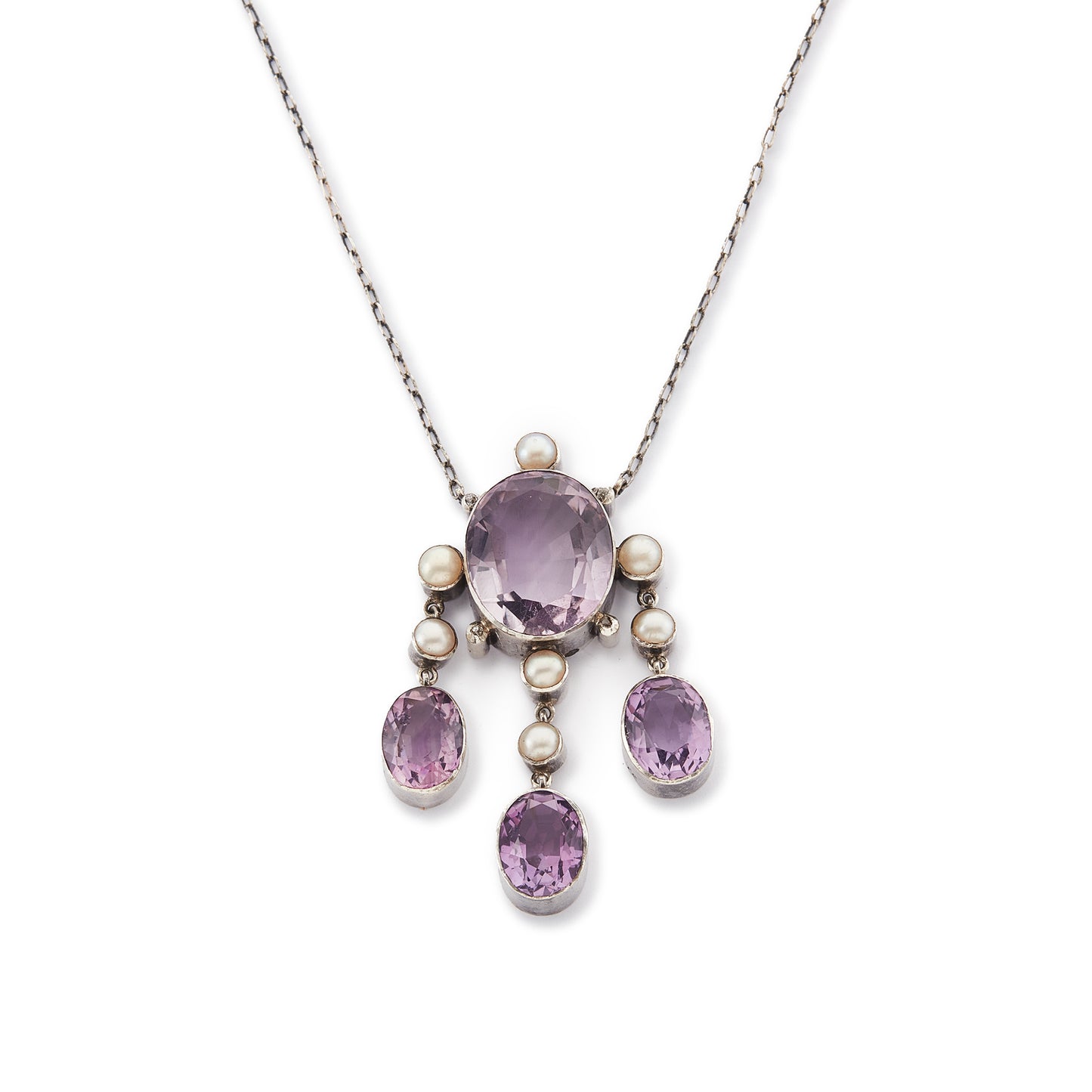 Beautiful Arts and Crafts silver necklace set with four chunky purple faceted amethysts, seven lustrous pearls and four tiny mine-cut diamonds. The necklace has a lovely toggle clasp.