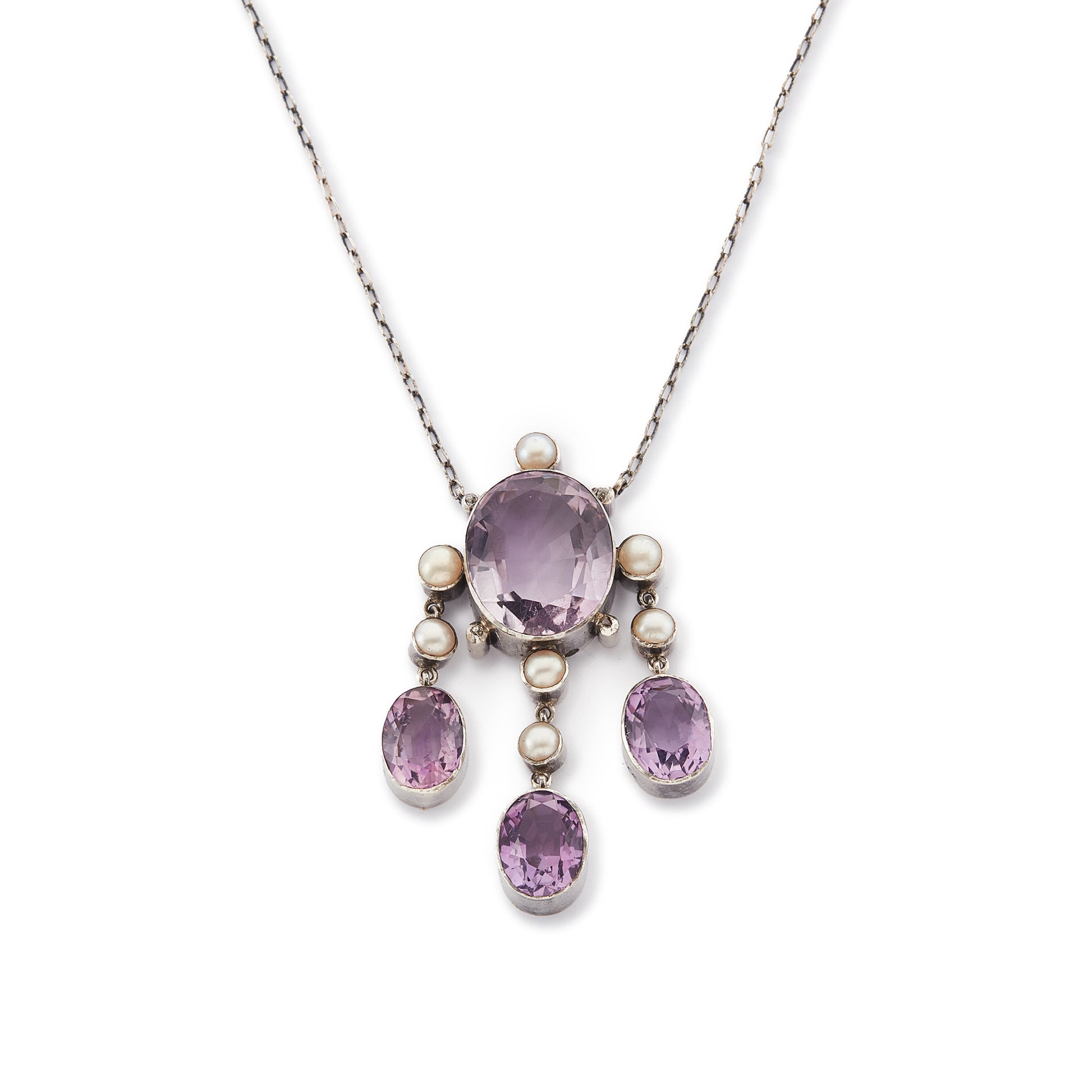Beautiful Arts and Crafts silver necklace set with four chunky purple faceted amethysts, seven lustrous pearls and four tiny mine-cut diamonds. The necklace has a lovely toggle clasp.