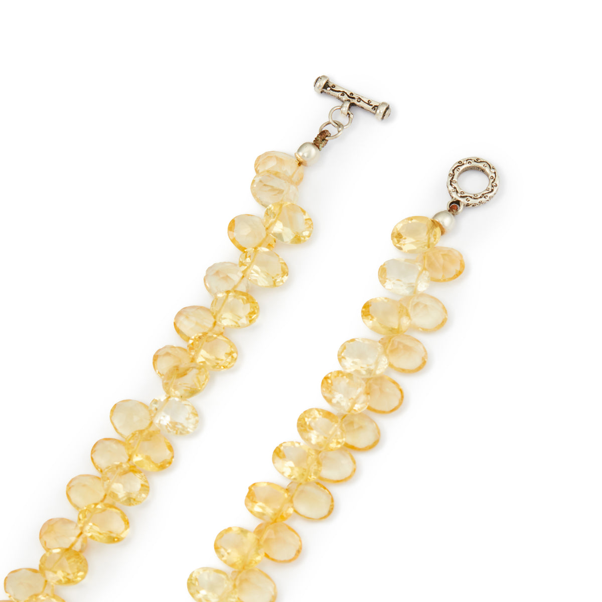 Stunning citrine necklace consisting of two rows of faceted citrine stones with a silver toggle clasp.