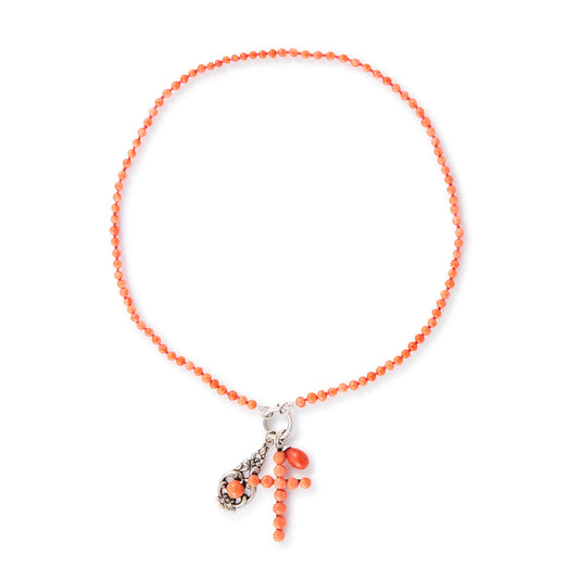 Quaint beaded natural coral necklace with three vintage silver and coral charms attached to a silver bolt ring.