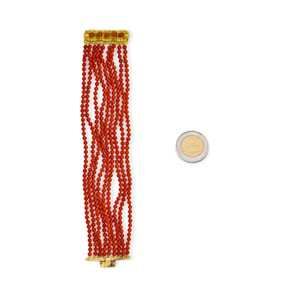 Striking nine-strand natural, vibrant red Mediterranean coral bracelet with a Victorian ormolu clasp, set with five cabochon coral beads.