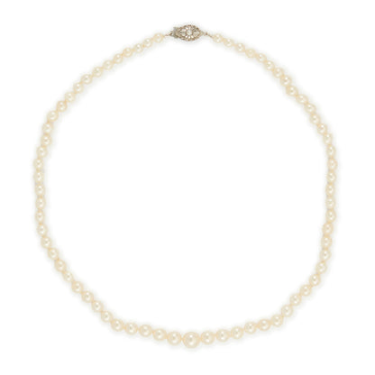 Lovely string of cultured seawater pearls with a sterling silver clasp set with a seed pearl. The pearls have a cream hue with a lovely lustre.