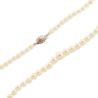 Lovely string of cultured seawater pearls with a sterling silver clasp set with a seed pearl. The pearls have a cream hue with a lovely lustre.