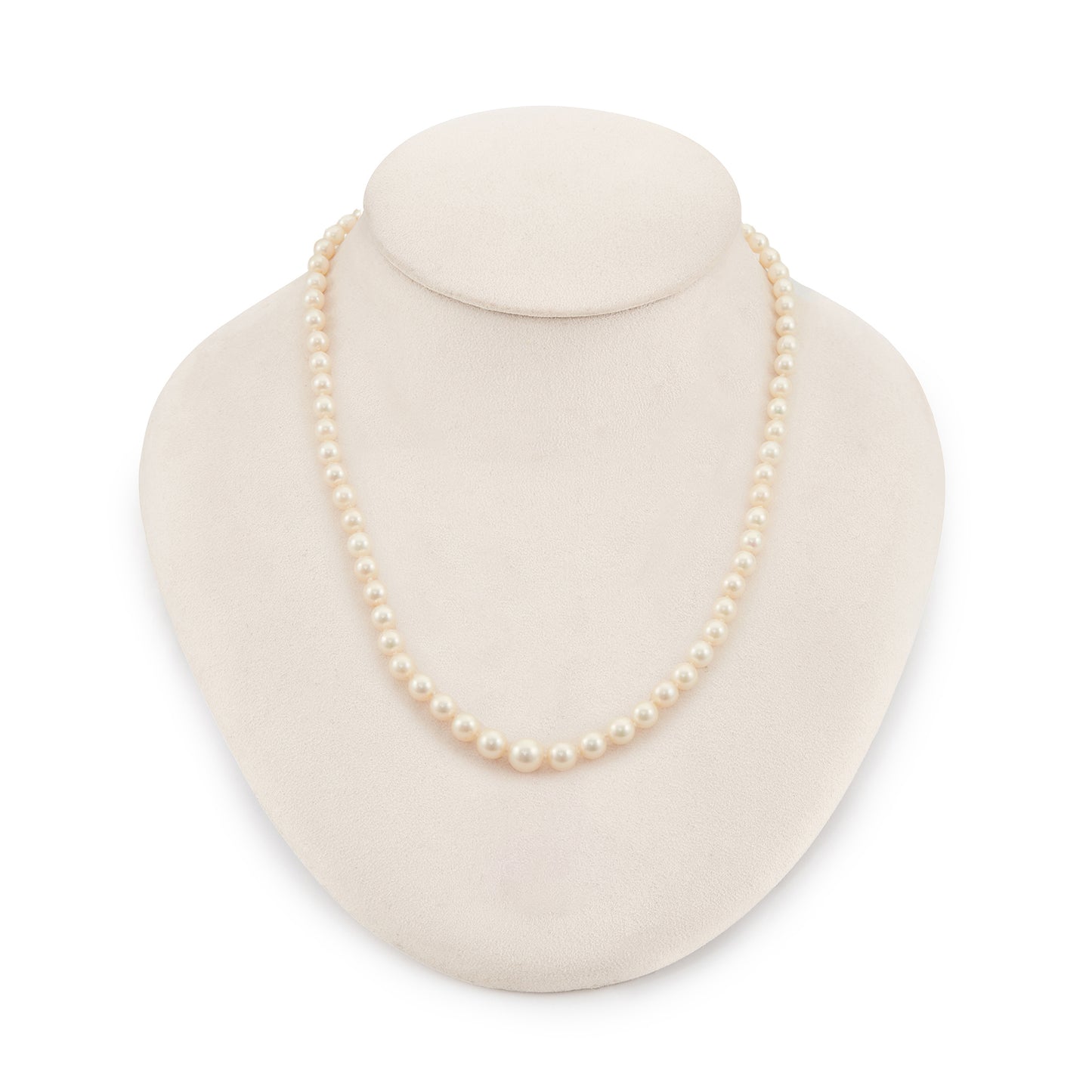 Lovely string of cultured seawater pearls with a sterling silver clasp set with a seed pearl. The pearls have a cream hue with a lovely lustre.