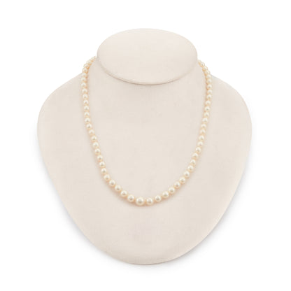 Lovely string of cultured seawater pearls with a sterling silver clasp set with a seed pearl. The pearls have a cream hue with a lovely lustre.