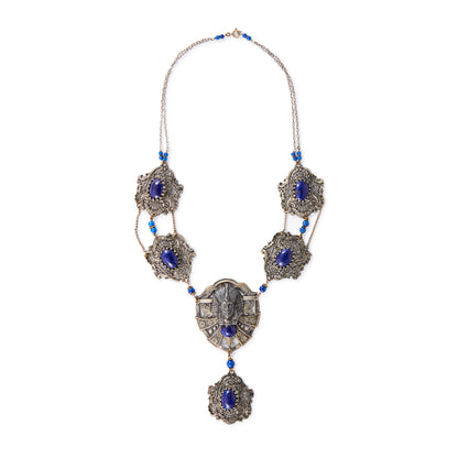 Magnificent Egyptian Revival necklace set with faux cabochon lapis lazuli stones. Base metal featuring lots of intricate detail with a Pharaoh's head. Circa 1920’s