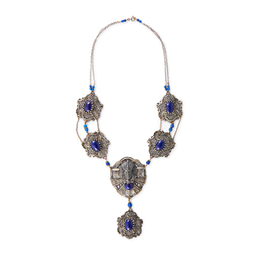 Magnificent Egyptian Revival necklace set with faux cabochon lapis lazuli stones. Base metal featuring lots of intricate detail with a Pharaoh's head. Circa 1920’s