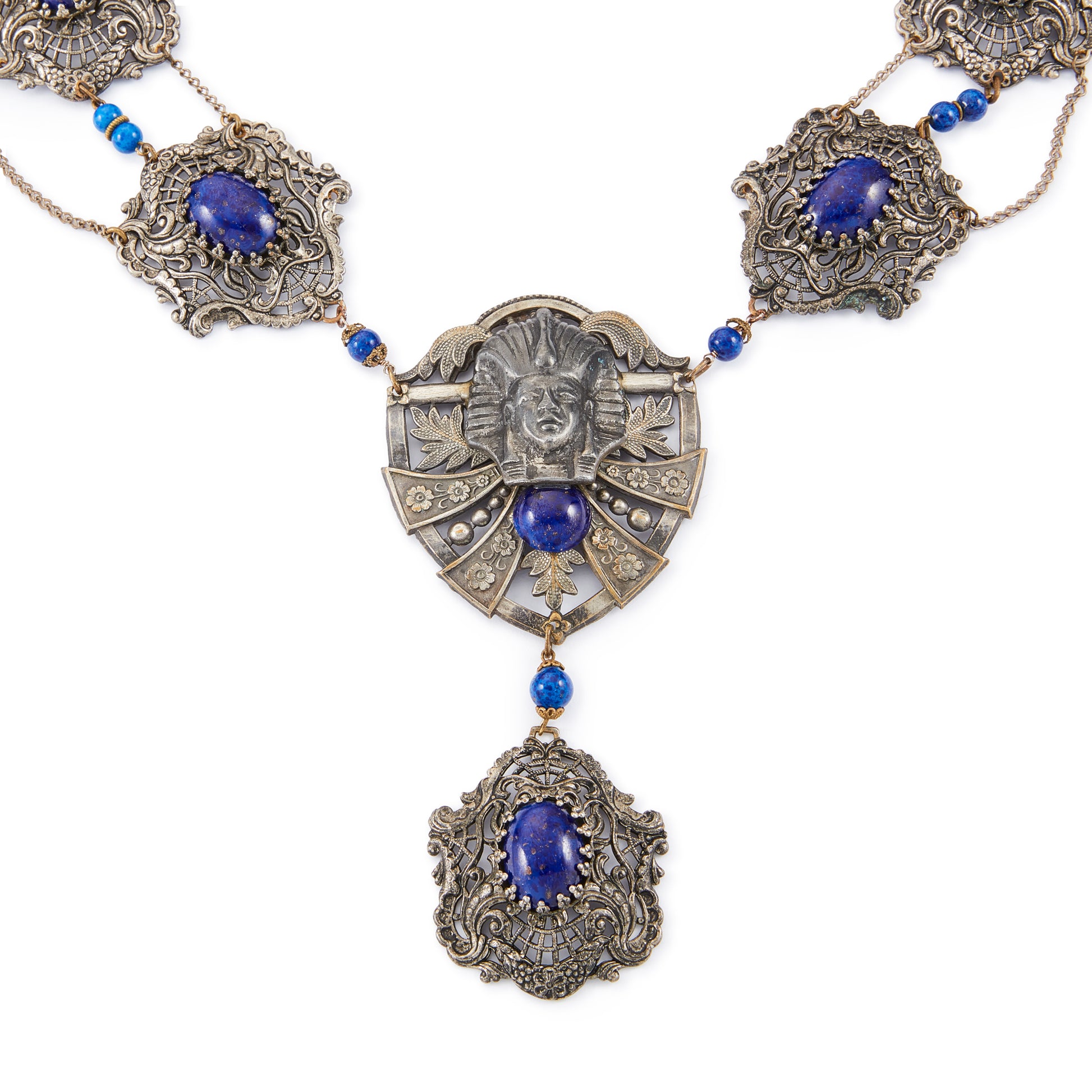 Magnificent Egyptian Revival necklace set with faux cabochon lapis lazuli stones. Base metal featuring lots of intricate detail with a Pharaoh's head. Circa 1920’s