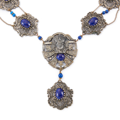 Magnificent Egyptian Revival necklace set with faux cabochon lapis lazuli stones. Base metal featuring lots of intricate detail with a Pharaoh's head. Circa 1920’s