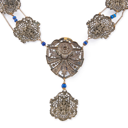 Magnificent Egyptian Revival necklace set with faux cabochon lapis lazuli stones. Base metal featuring lots of intricate detail with a Pharaoh's head. Circa 1920’s
