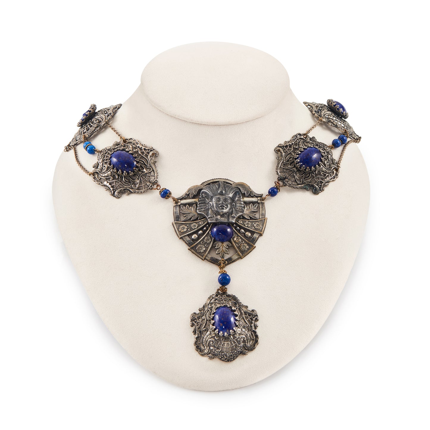 Magnificent Egyptian Revival necklace set with faux cabochon lapis lazuli stones. Base metal featuring lots of intricate detail with a Pharaoh's head. Circa 1920’s