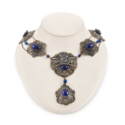 Magnificent Egyptian Revival necklace set with faux cabochon lapis lazuli stones. Base metal featuring lots of intricate detail with a Pharaoh's head. Circa 1920’s
