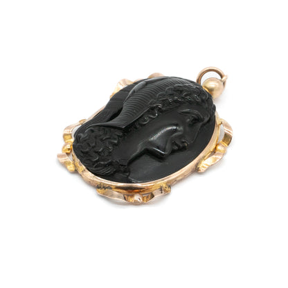 Lovely Victorian pendant set with a beautifully carved jet cameo depicting a classic roman head, with an ornate 9ct rose gold frame. London