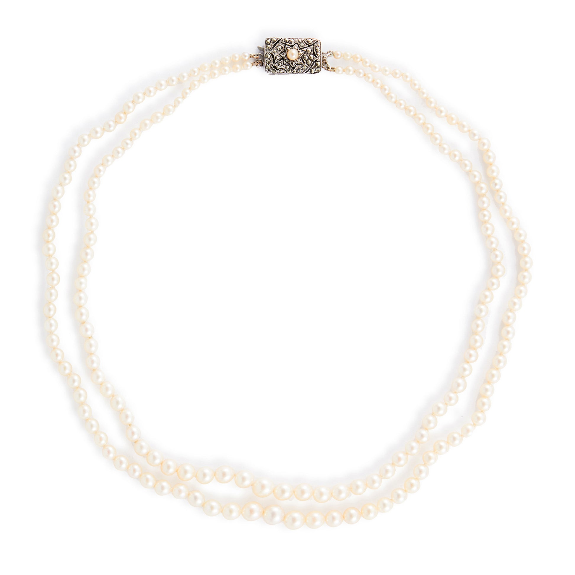 Beautiful pearl necklace consisting of two strands of creamy graduated seawater pearls, finished with a stunning vintage sterling silver, marcasite and seed pearl clasp. The pearls have a lovely lustre.