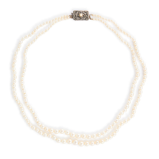 Beautiful pearl necklace consisting of two strands of creamy graduated seawater pearls, finished with a stunning vintage sterling silver, marcasite and seed pearl clasp. The pearls have a lovely lustre.