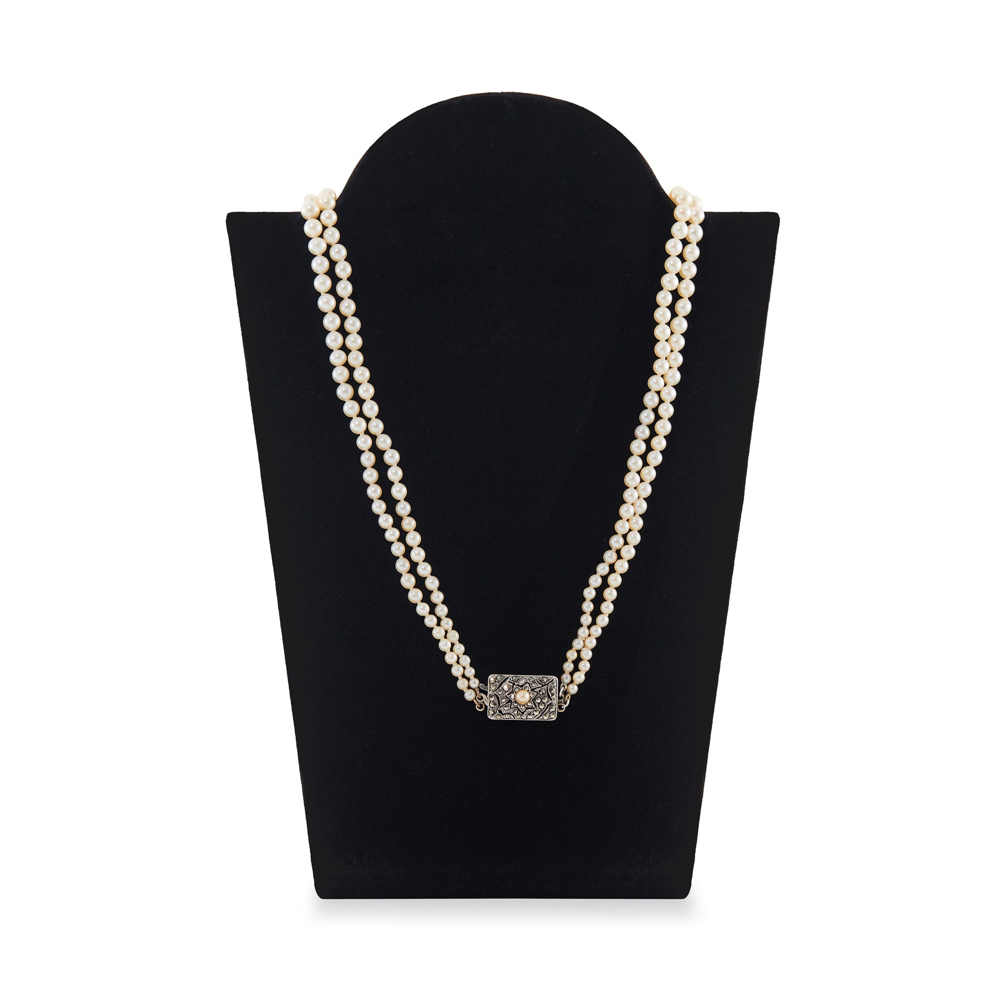 Beautiful pearl necklace consisting of two strands of creamy graduated seawater pearls, finished with a stunning vintage sterling silver, marcasite and seed pearl clasp. The pearls have a lovely lustre.